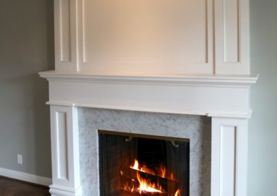 white wood handbuilt fireplace marble trim