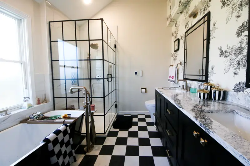 remodeled primary bathroom with shower, bathtub and double vanity by Agape Construction