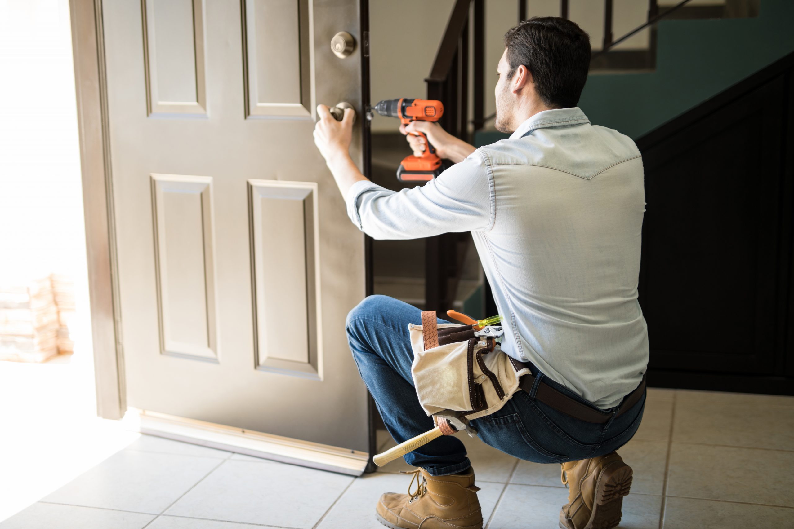 Handyman fixes door