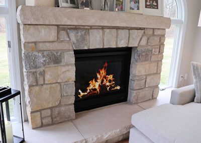 cu stone fireplace in sunroom