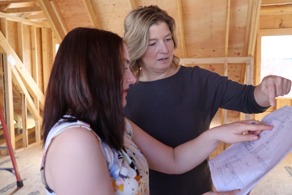 Design team looks over blueprints