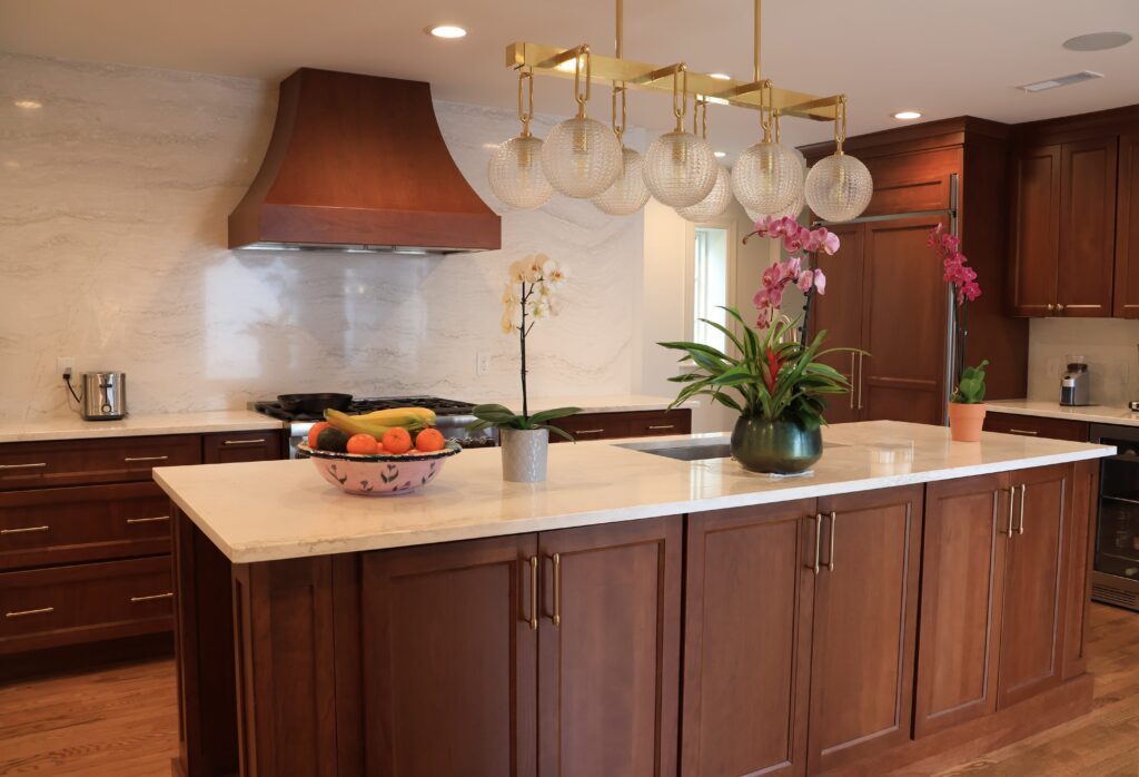 cherry wood cabinetry with gold pulls kitchen
