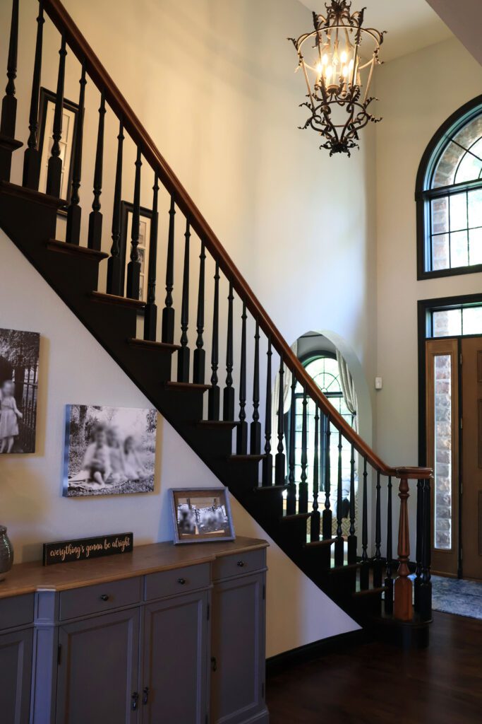 tall-foyer-stairwell-hard-to-reach-light-handyman-agape-construction-handyman-st-louis hard to reach light fixture