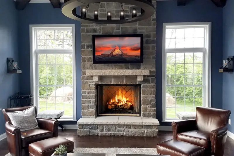 blue cozy warm fireplace stone masonry work by Agape Construction in St. Louis