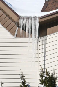 clogged gutter creating dangerous ice