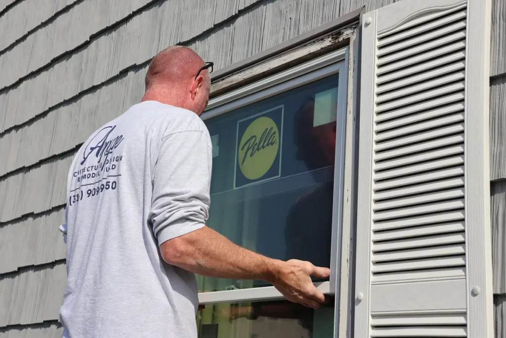 Agape installing Pella Window