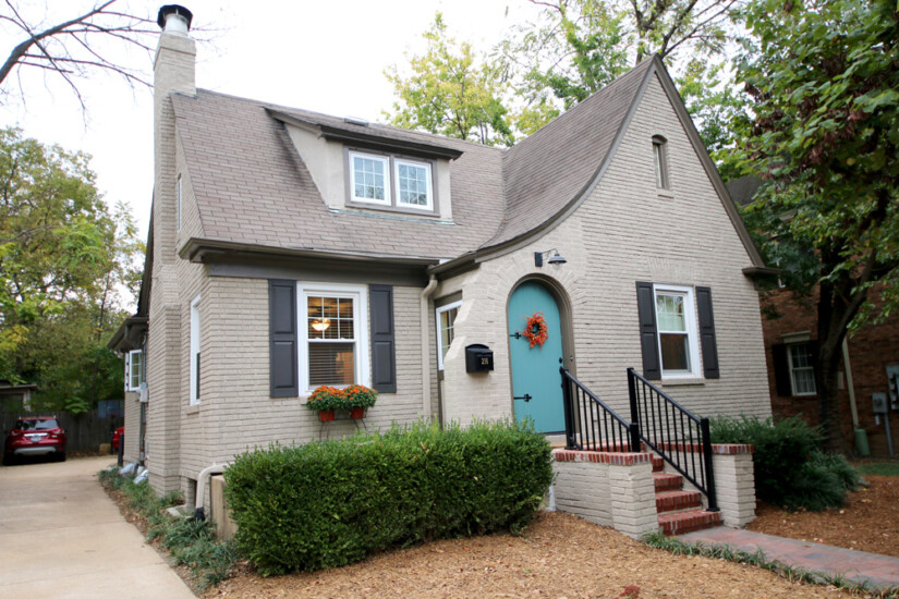grey brick cottage blue door restoration