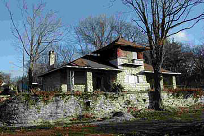 Historic train depot-turned-residence from the outside before the renovation project completed by Agape Construction.