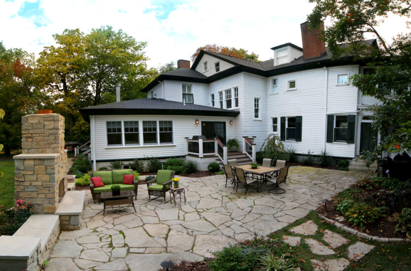 back patio porch dining brick fireplace lawn furniture stone