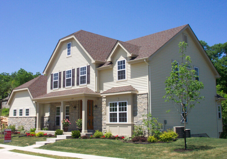 A new home's front facade as seen from the street, built by Agape Construction