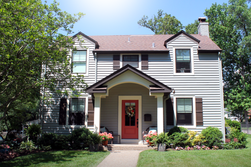 A 2-story home facade featuring a bold accent door by Agape Construction of Kirkwood and Chesterfield, MO.