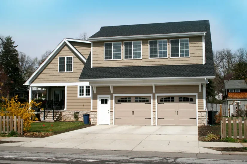 A second-story addition over custom, two-door garage. By Agape Construction.