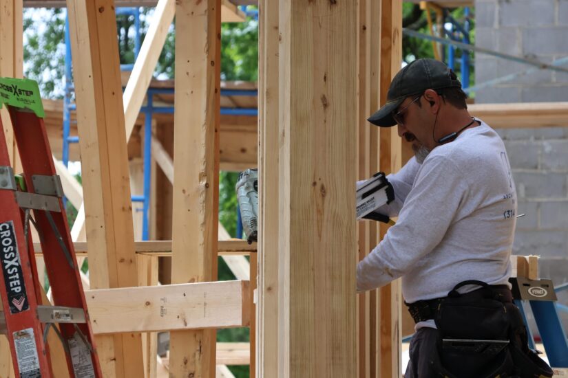 framing carpenter working on home addition