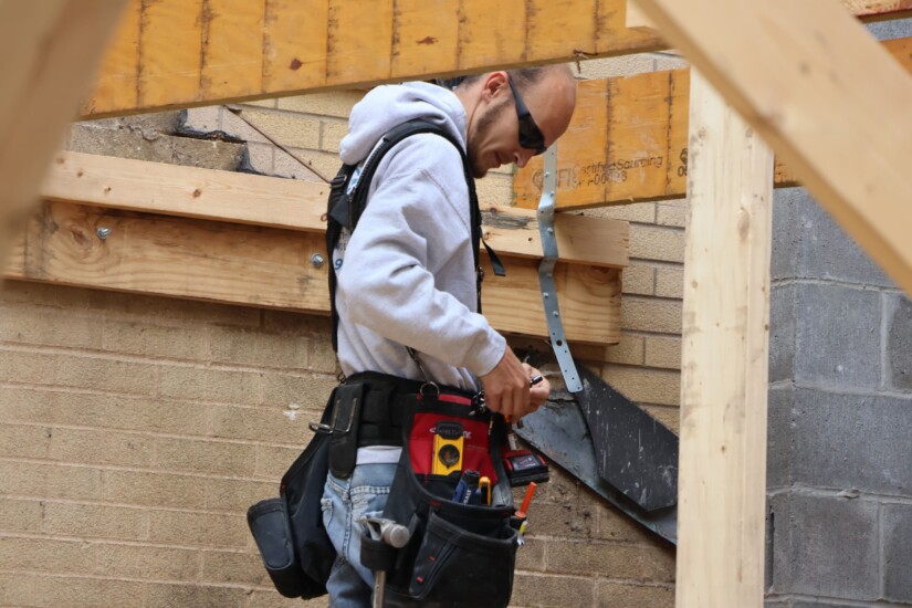 framing carpenter working on home addition