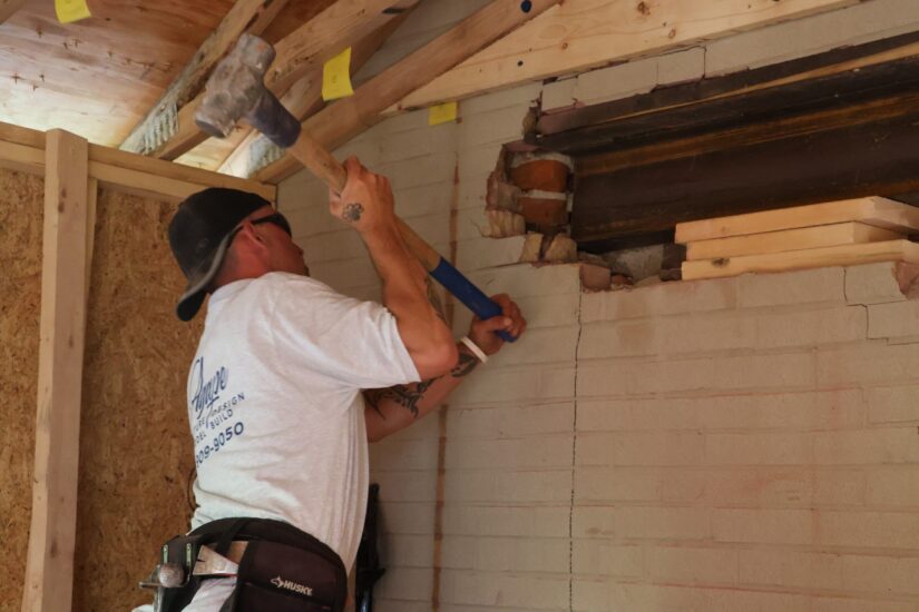 Construction crew removing wall