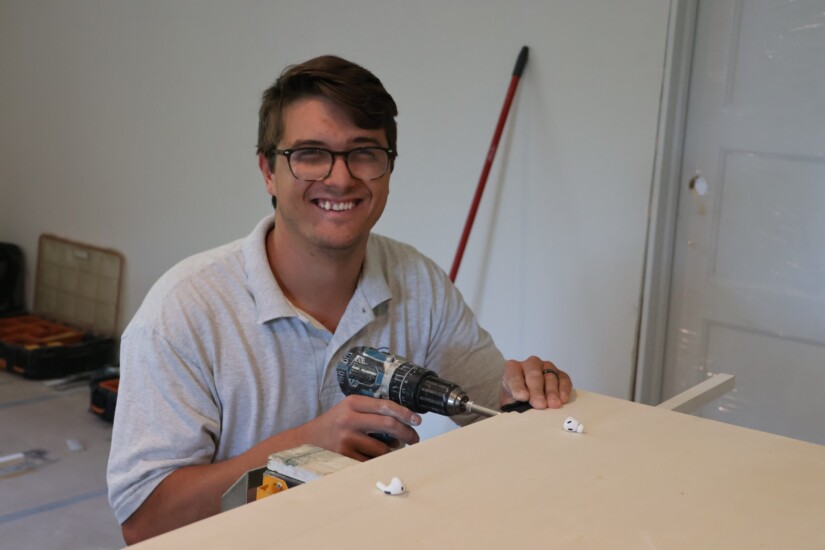 Agape employee enjoying his work