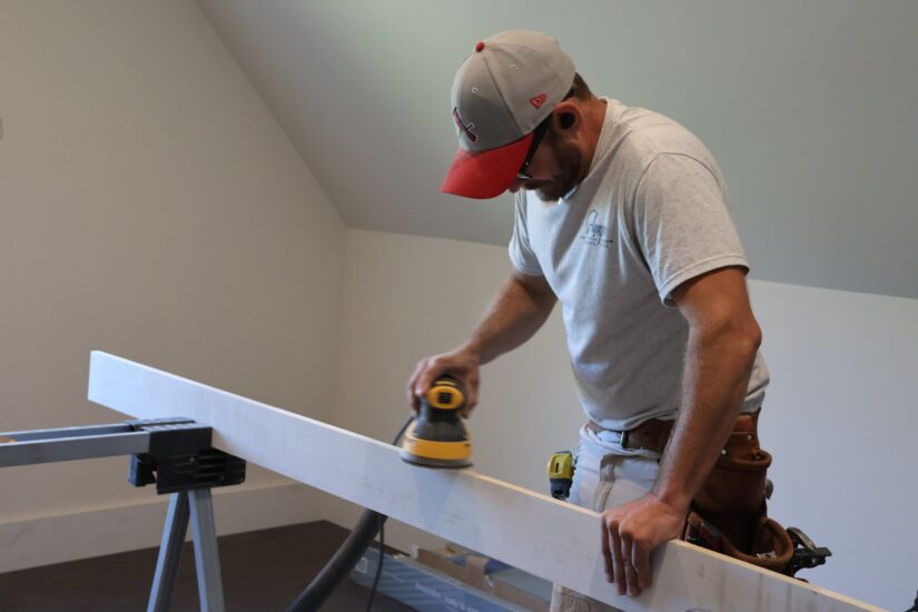 construction worker finishing home attic