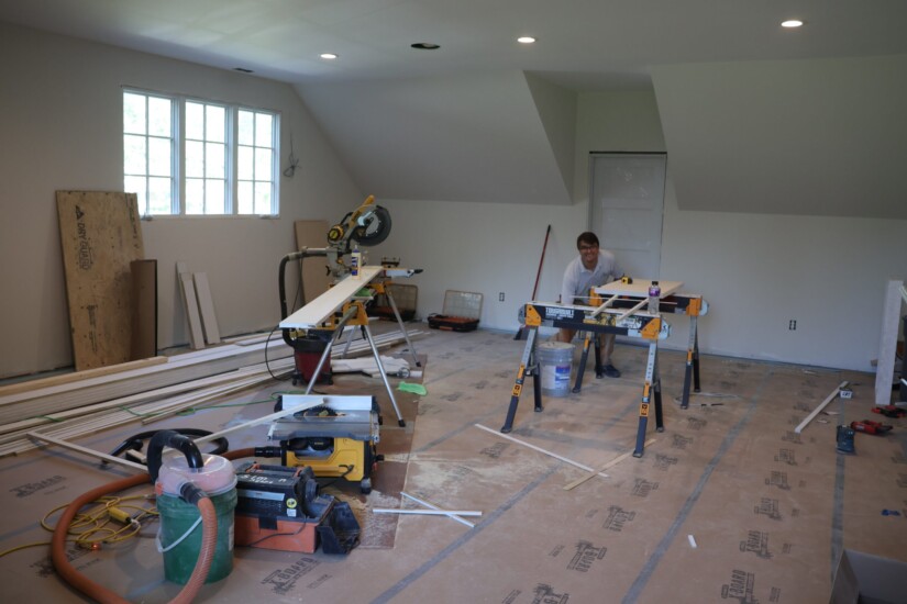 construction crew finishing attic space