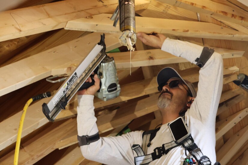 construction worker building a new trellis