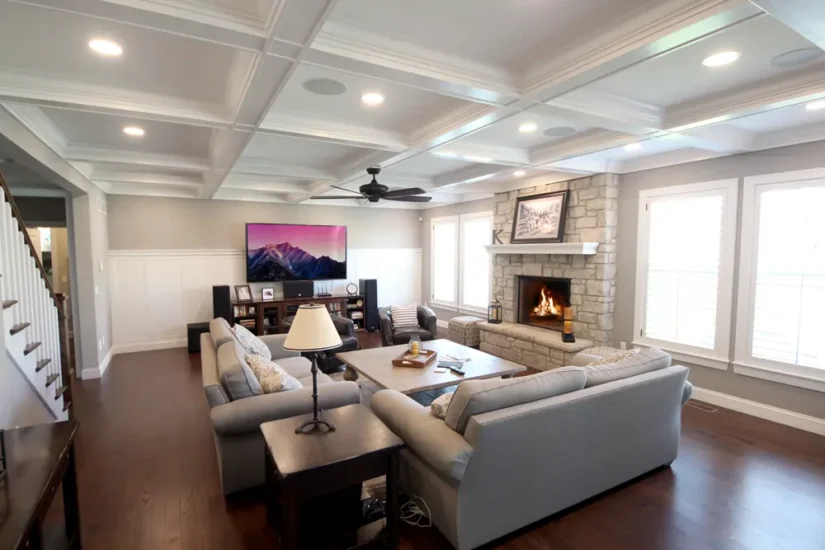 Living area with fireplace renovation, by Agape Construction.