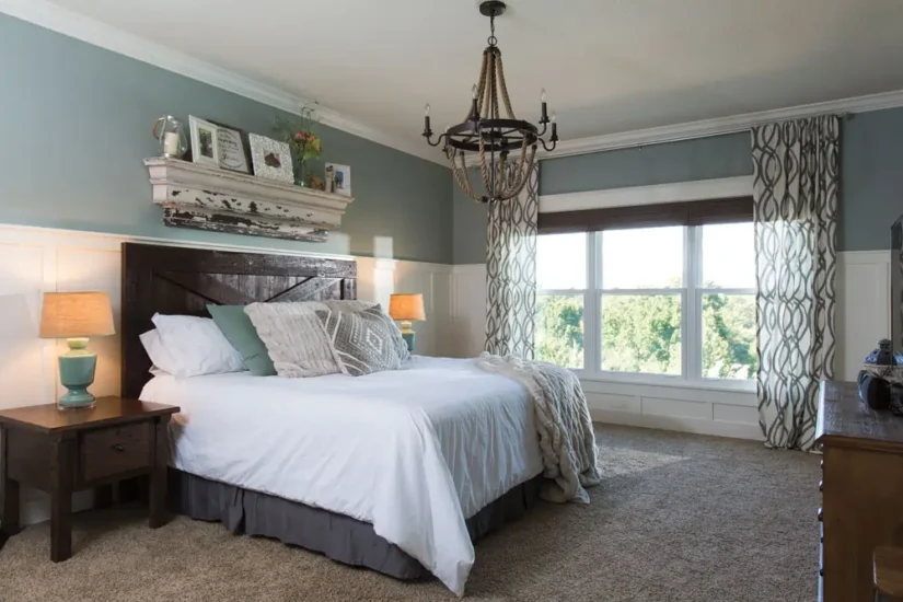 A country-inspired primary bedroom project by Agape Construction, featuring sunny greens and natural light.
