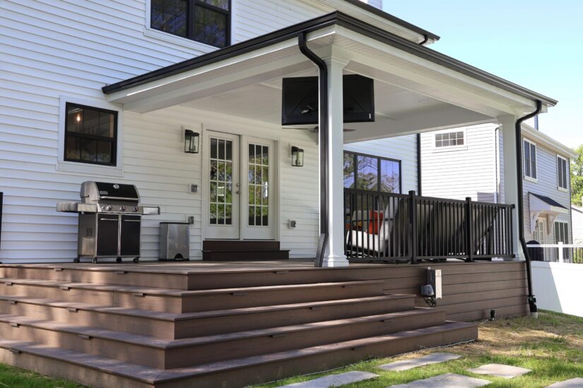 New covered deck attached to back of home