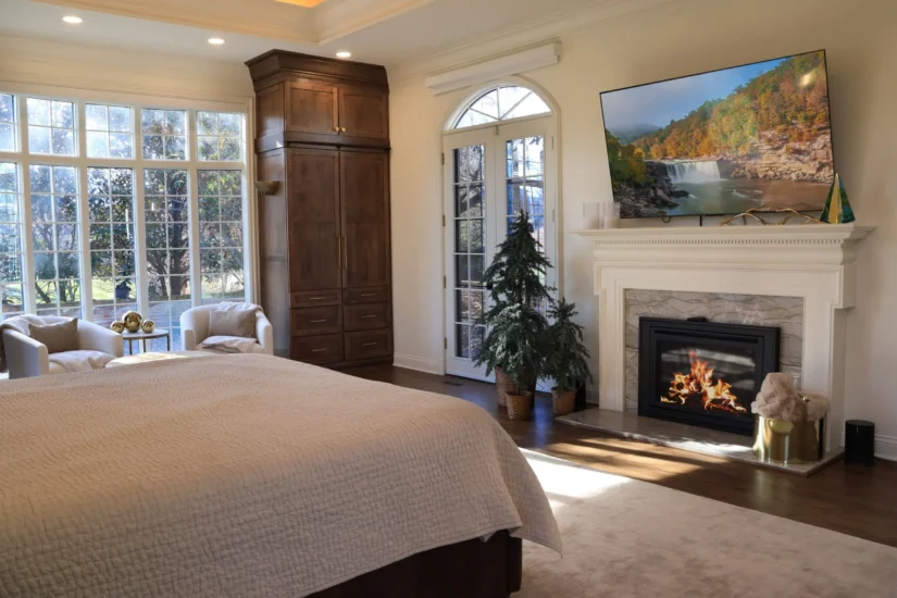 A completed primary bedroom project by Agape Construction, featuring gas fireplace.