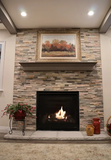 A gas fireplace project completed by Agape Construction in a client's home basement.