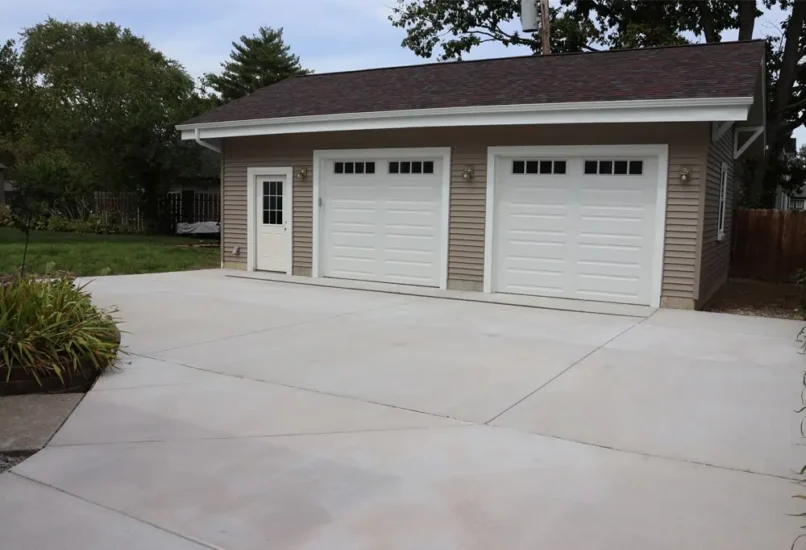 A new, 2-car garage and driveway addition by Agape Construction.