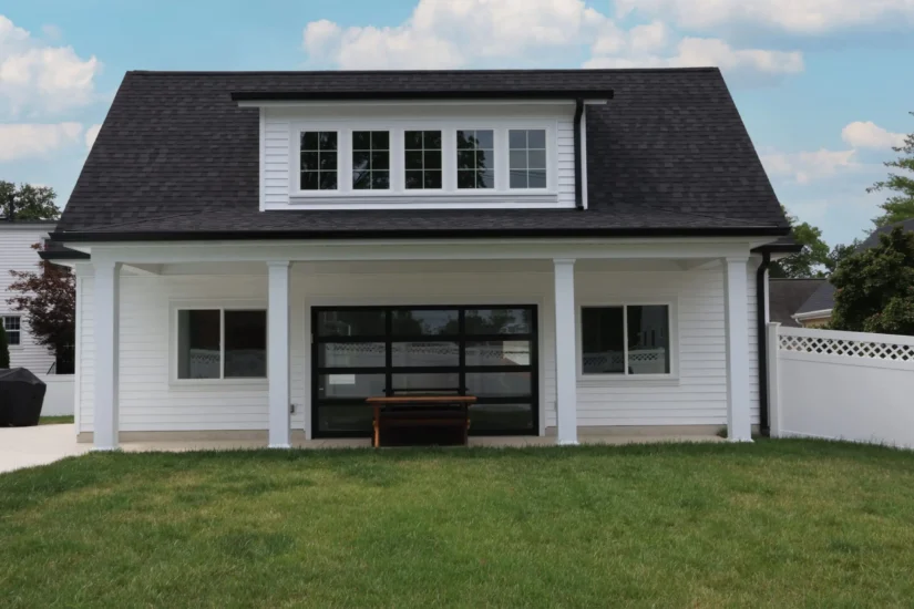 A flex space; carriage house, garage, and pool house, by Agape Construction.