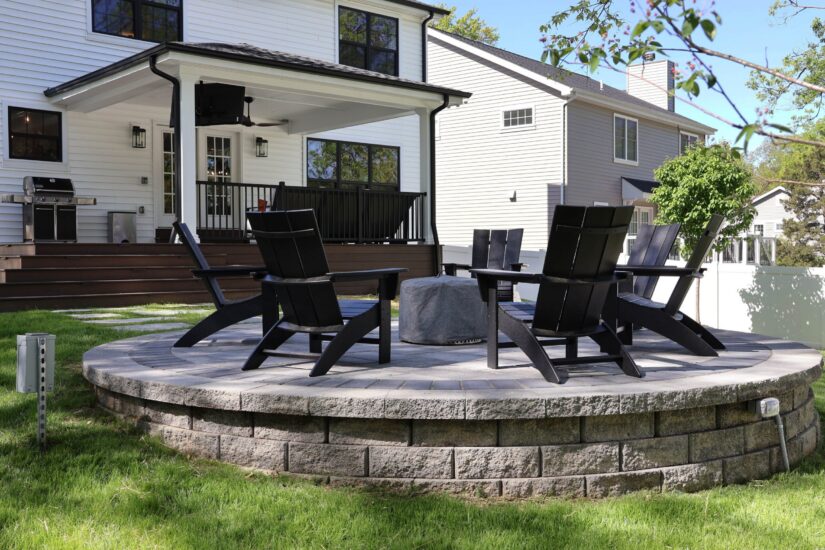 outdoor living area with covered deck and patio in yard
