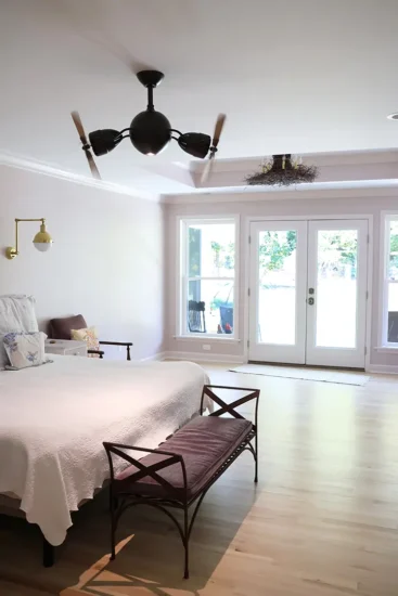 A primary bedroom suite, completed by Agape Construction.