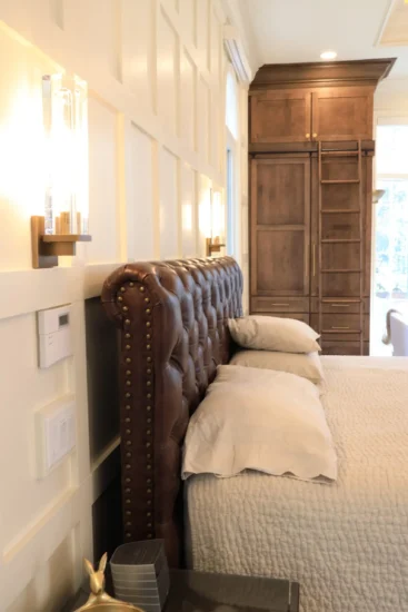 An accent wall by Agape Construction, within a primary bedroom, post-renovation.