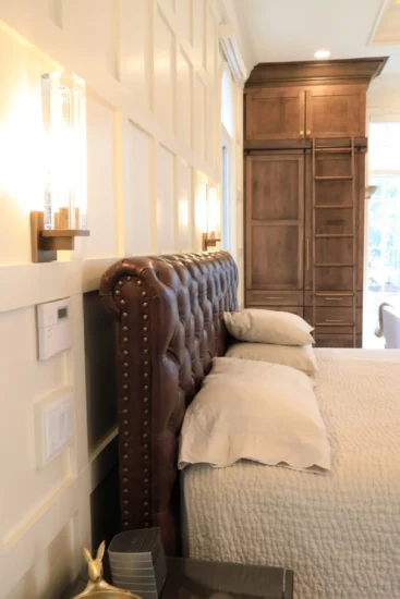 An accent wall by Agape Construction, within a primary bedroom, post-renovation.