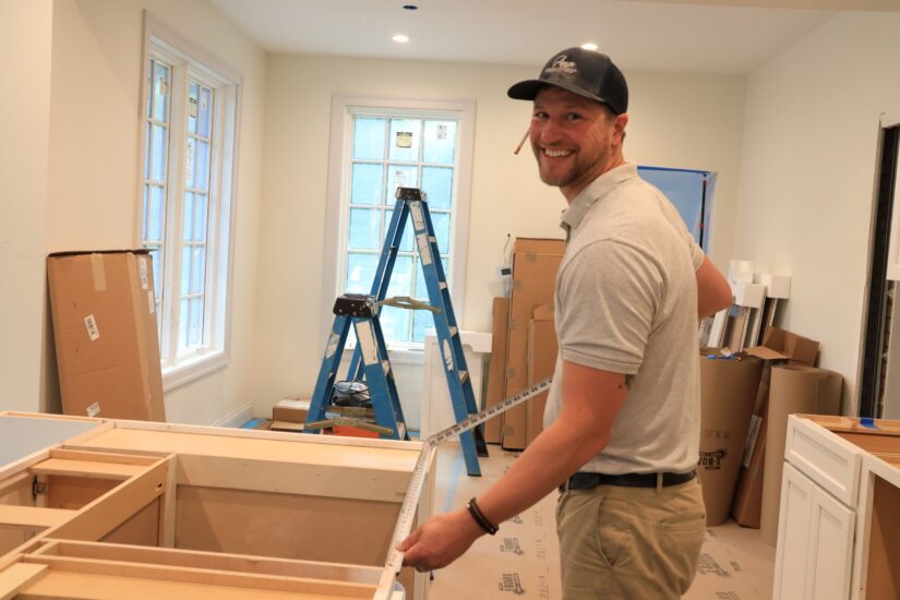 carpenter working on new kitchen install