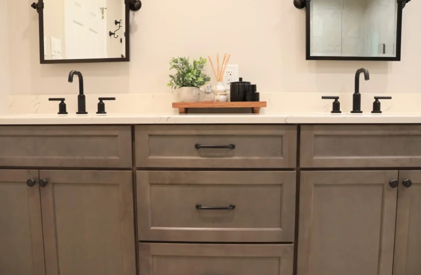 lovely hall bathroom with natural wood toned cabinets