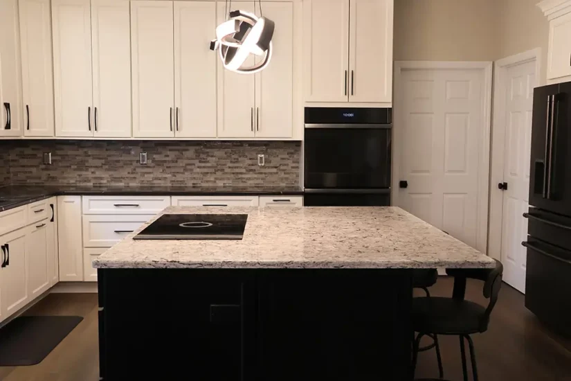 large black and white kitchen with artistic lighting