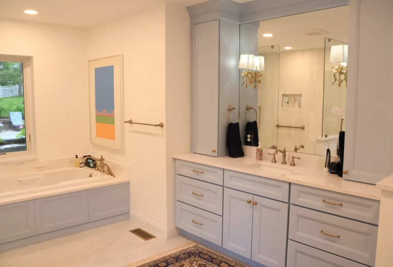 primary bath in soft blue with soaker tub and vanity