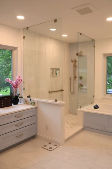 primary bath in soft blue with separate tub and shower