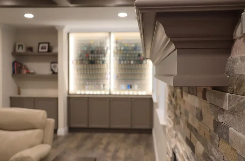 fireplace and accent wall in finished basement