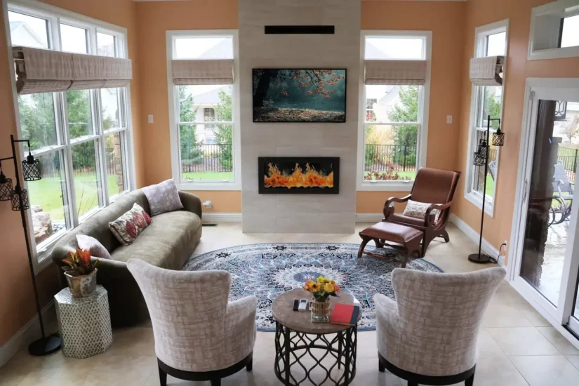 sunroom addition with stone fireplace