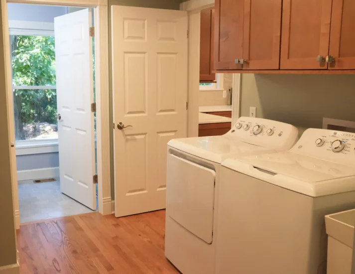 laundry room by Agape Construction